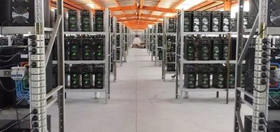 Expansive cryptocurrency mining farm with rows of operational miners